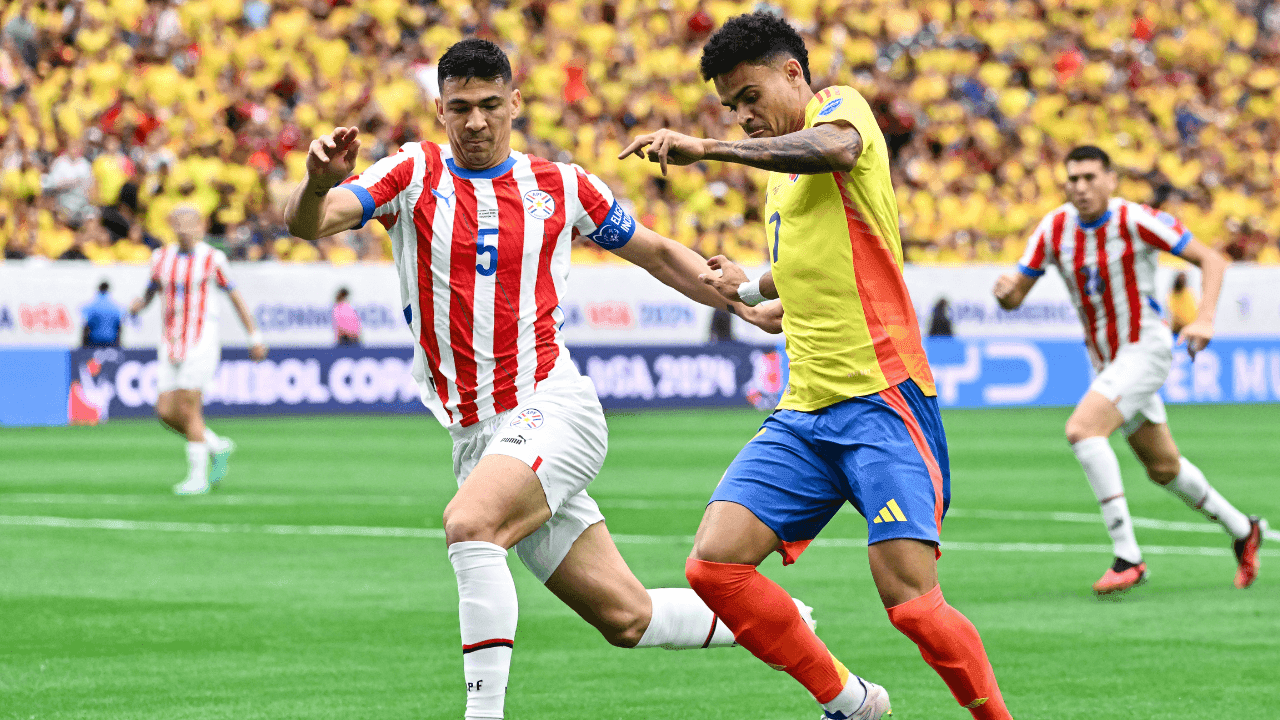 photologuephotos2025-03luis_diaz_regatea_ante_un_defensor_paraguayo_en_la_copa_america_2024png