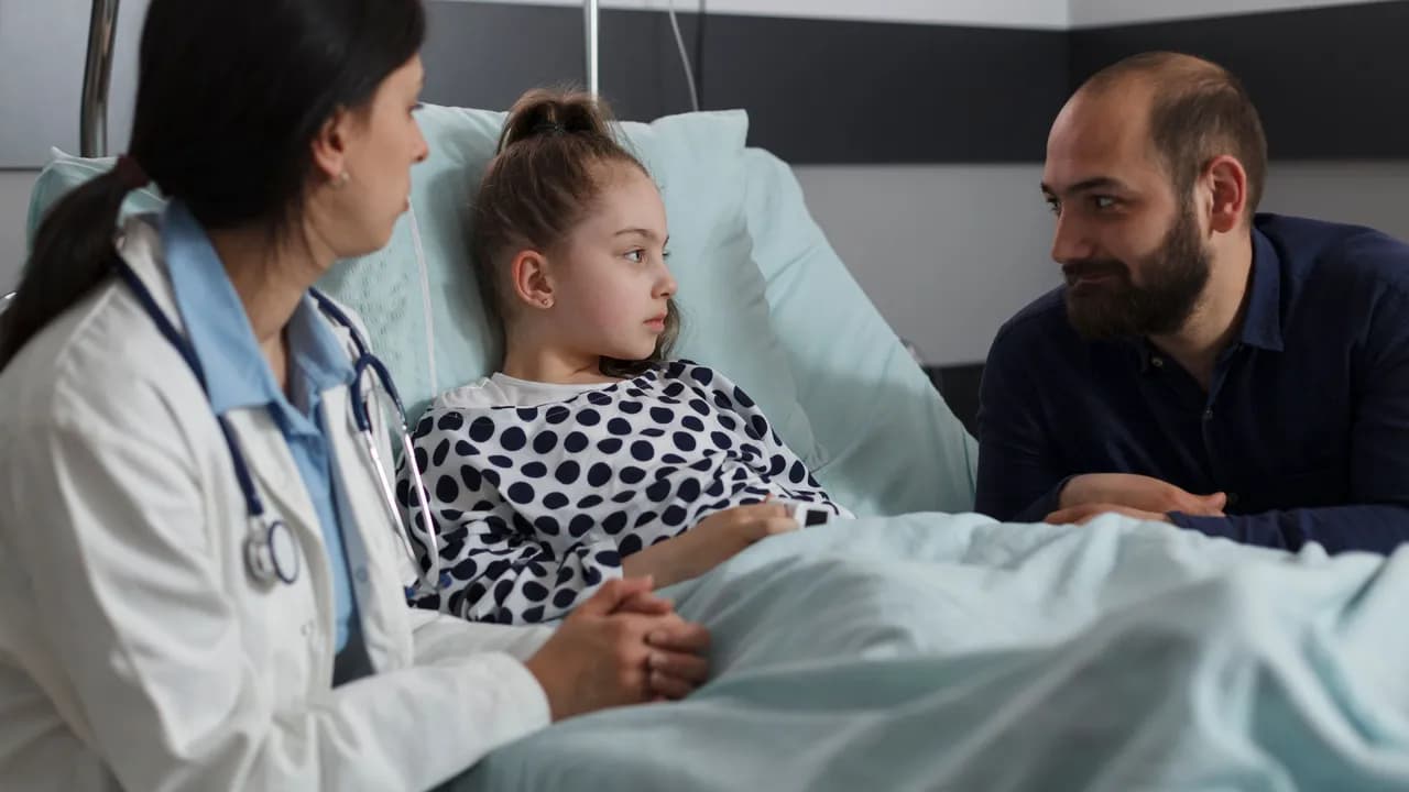 photologuephotos2022-10pediatrician-examining-ill-kid-health-condition-while-discussing-with-parent-caring-father-sitting-next-to-sick-daughter-resting-in-hospital-pediatric-ward-while-doctor-presenting-treatment-schemejpg photologuephotos2022-10pediatrician-examining-ill-kid-health-condition-while-discussing-with-parent-caring-father-sitting-next-to-sick-daughter-resting-in-hospital-pediatric-ward-while-doctor-presenting-treatment-schemejpg