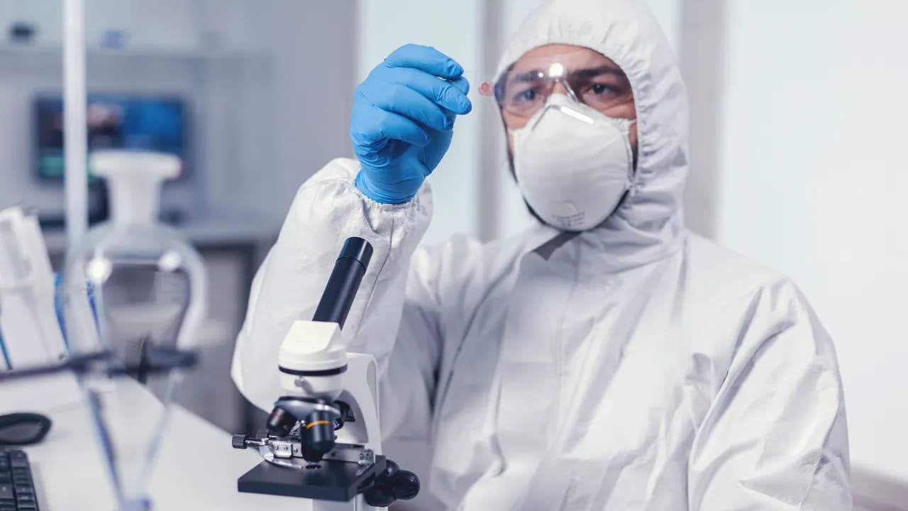 photologuephotos2024-08scientist-looking-microscope-slide-dressed-coverall-coronavirusjpg photologuephotos2024-08scientist-looking-microscope-slide-dressed-coverall-coronavirusjpg